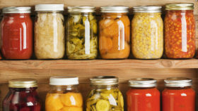 Home Canning Fruit and Vegetable Food Preserves in Storage Shelves